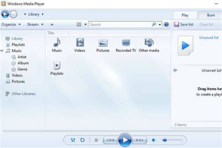 How can I configure Windows Media Player to manage my music library?