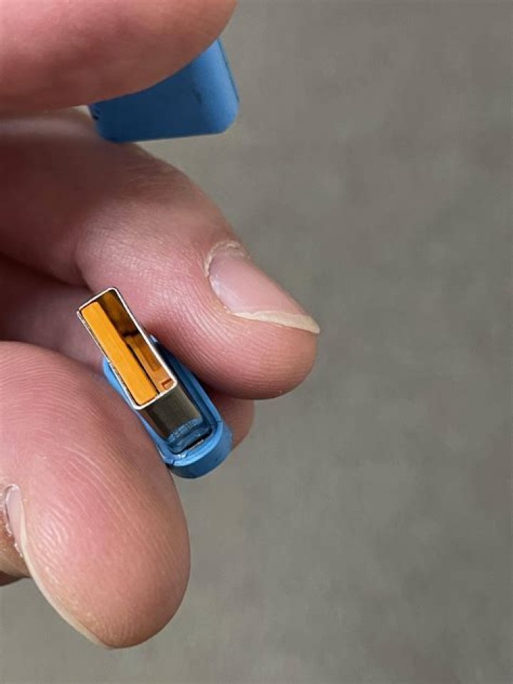 What is this blue USB device with an orange tongue?