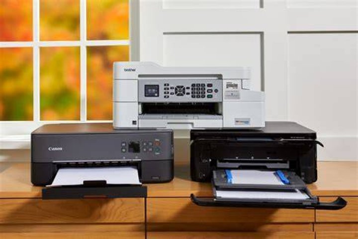 Why shouldn't I attach laser printers or scanners to a UPS?